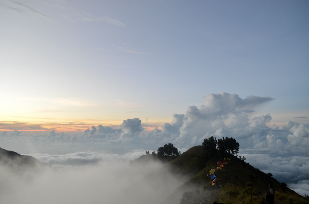 clouds rolling over volcano