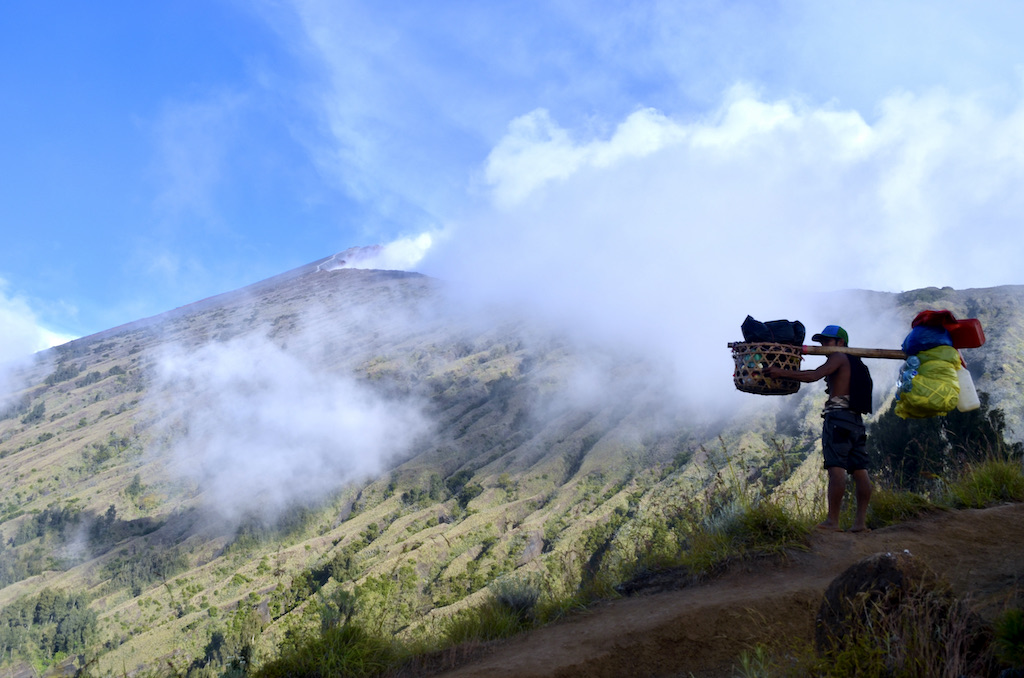 a sherpa holding items