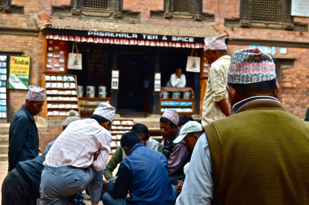 man walks towards a group of men playing a game