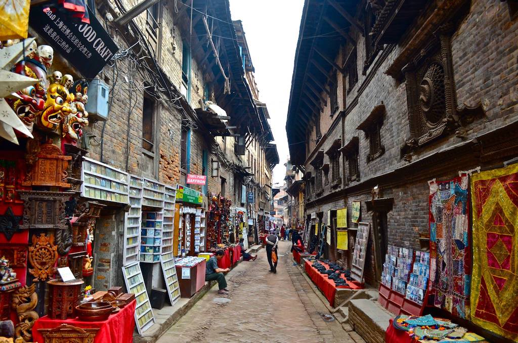man walking down alley in nepal